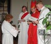 [Anne Williams signs the d...]