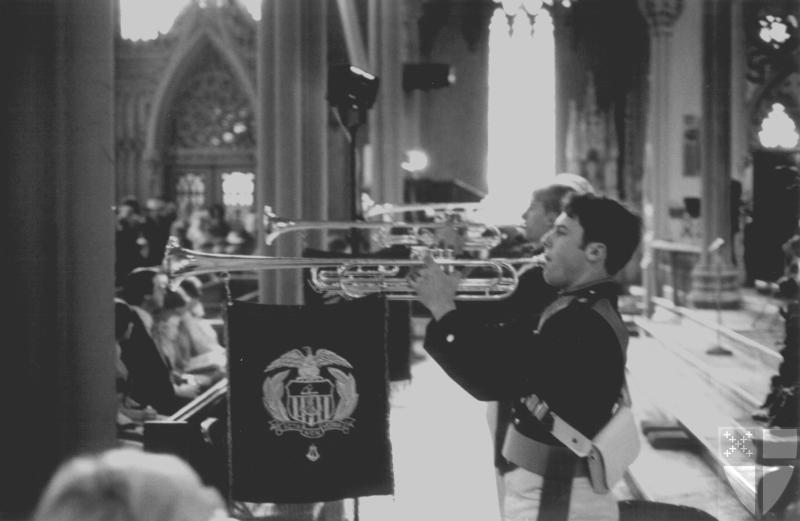 [A trumpet fanfare by the...]