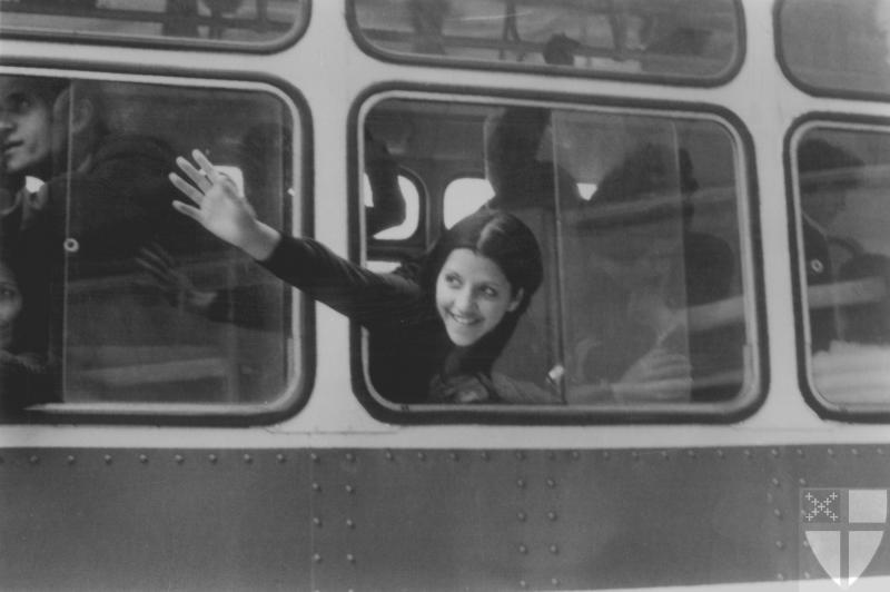 [A young woman waves as sh...]