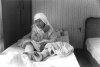 [thumbnail: An elderly woman rests in...]